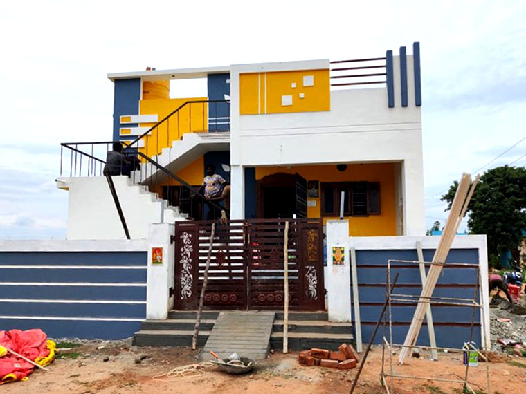 House with compound wall, gate and painted facade at the finishing stage, VK Builders project