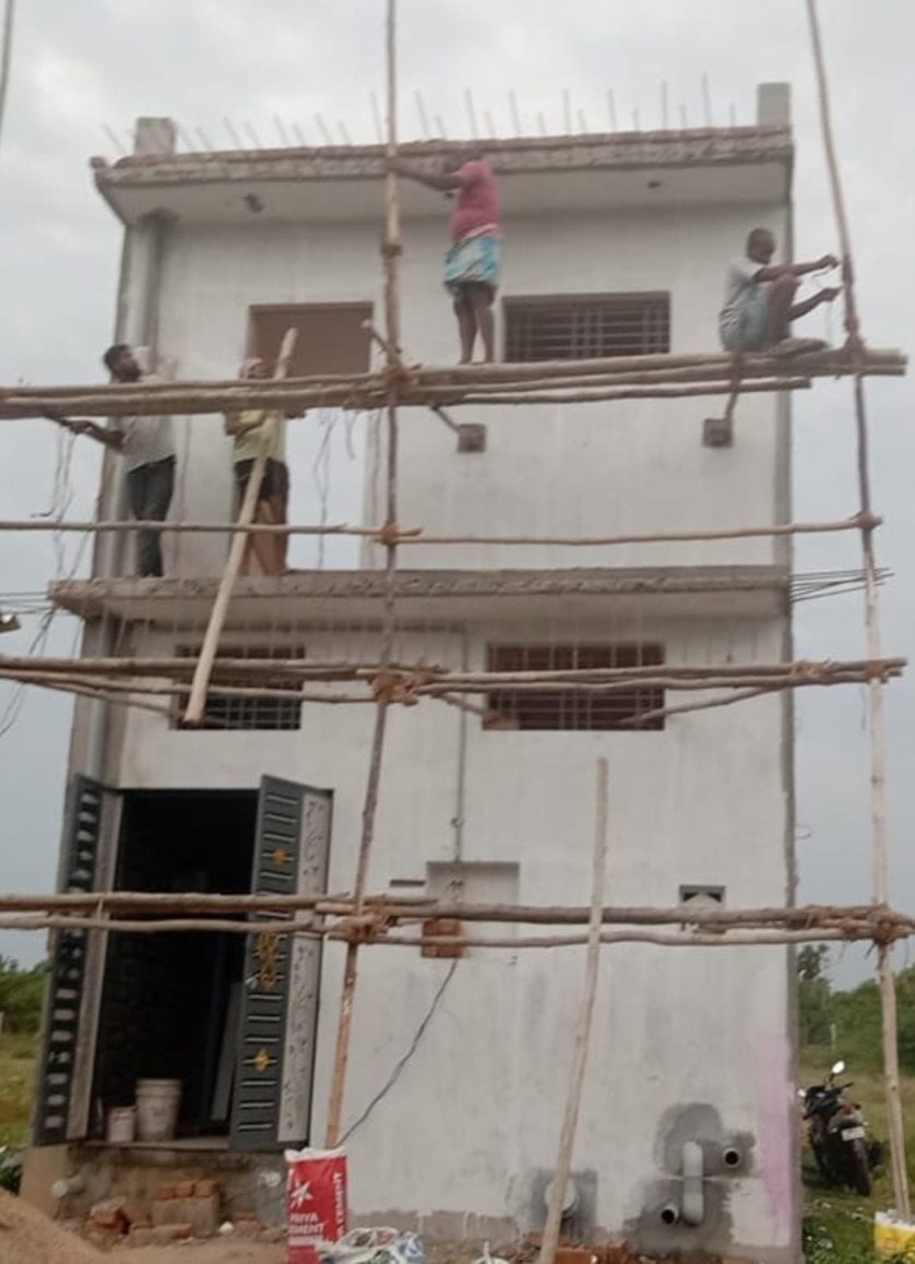 VK Builders workers on bamboo scaffolding during construction of a three-storey building, Chennai